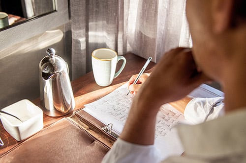 Man writing note pad