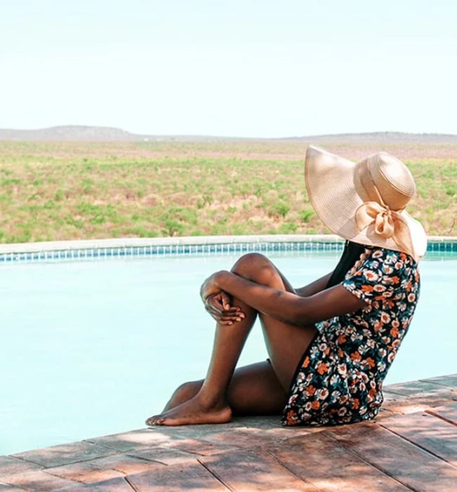 Pool, woman with sunhat, Namibia Pool, woman with sunhat, Namibia