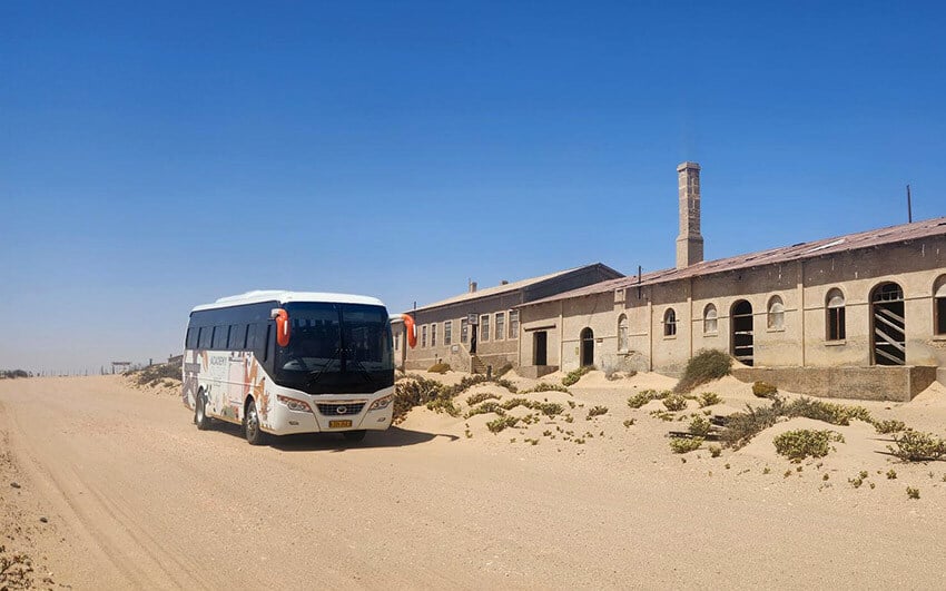 Bus in front ofentrance, Kolmanskop, Namibia