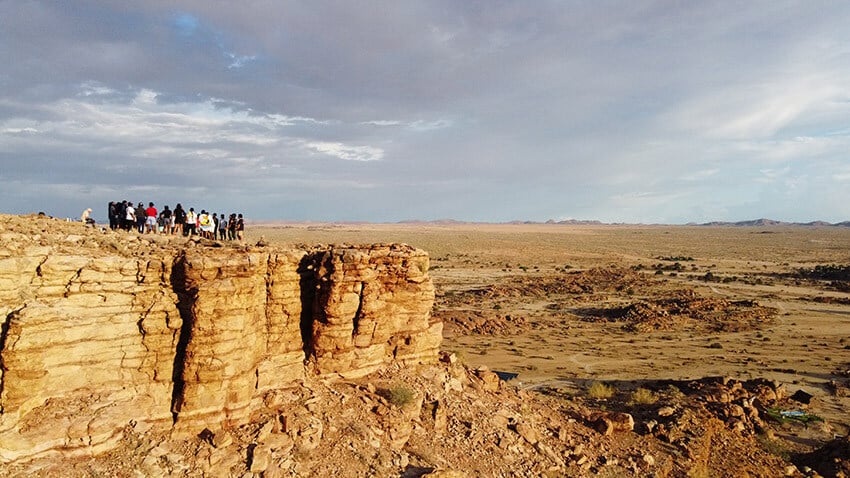 Group on top of rocky crest, Namibia