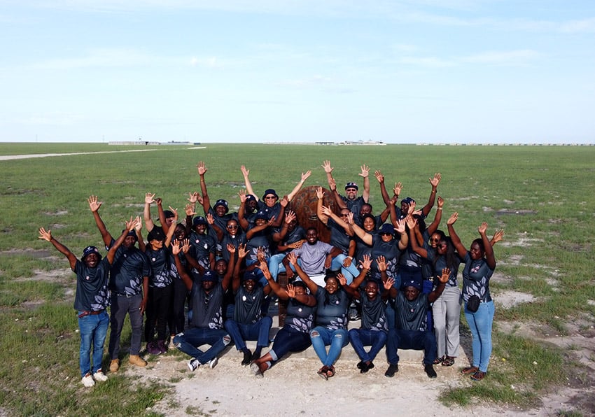 Group of Namibians waving, Andoni Plain, Namibia