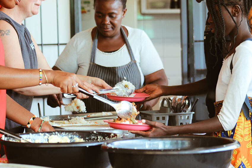 Namibian women handing out a meal