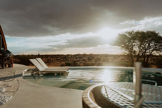 Reverie Kalahari Namibia sunset pool