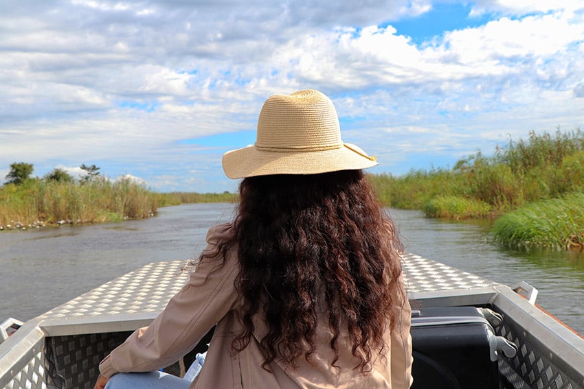 Zambezi boat, woman, Namibia