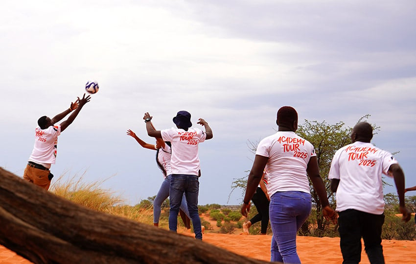 People playing volleyball, kalahari dune, Namibia