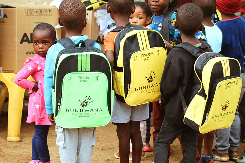 Gondwana branded backpacks, carried by Namibian children