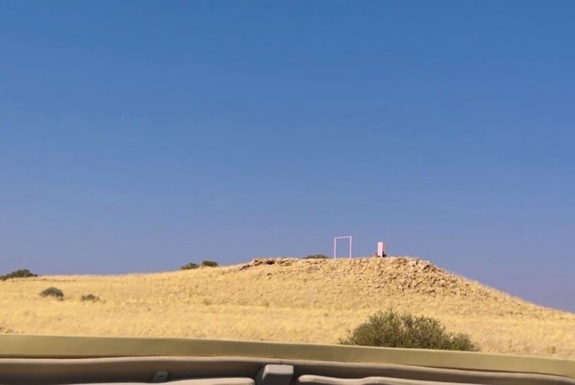 Desert grace Pink fridge atop hill