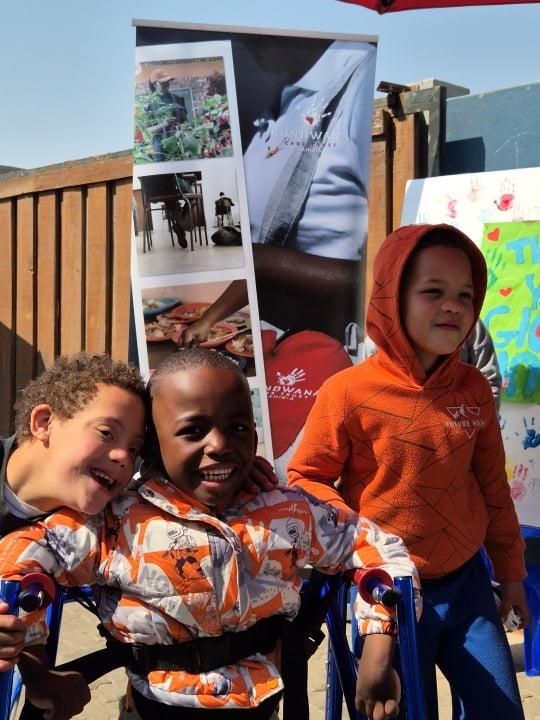 Enzo smiling with friends, Gondwana Care Trust