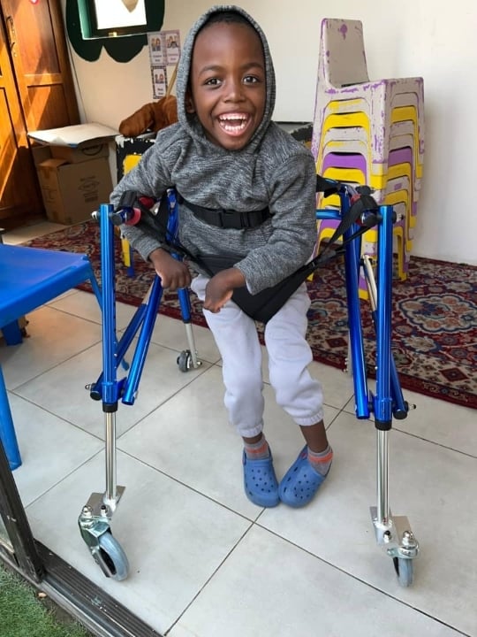 Enzo with his specialised walker, Gondwana Care Trust
