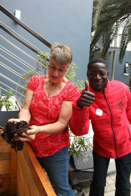 The Delight Swakopmund team during Vermicomposting Initiative holding compost