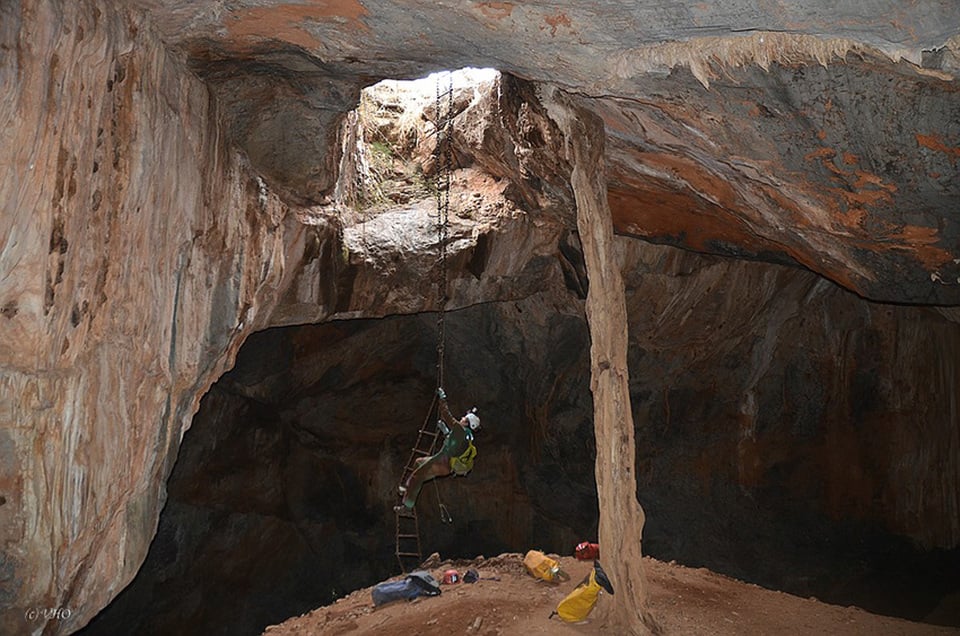 A man ropes down, Dragons Breath  Cave, Namibia