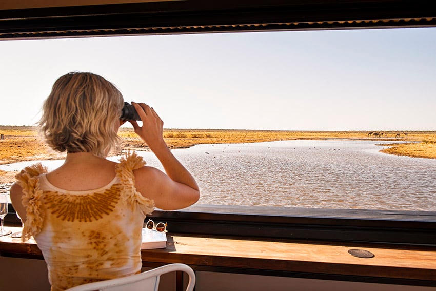 Women at waterhole in Etosha, Namibia