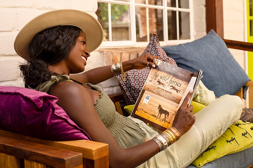 Woman reading a book, Namibia