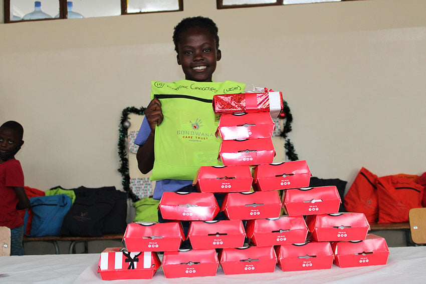 Namibian girls smiles while receiving a donation
