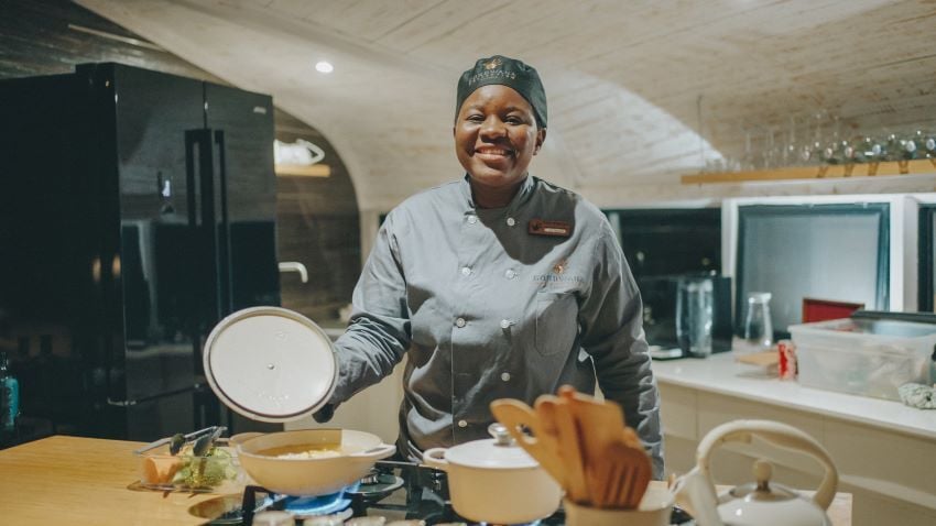 Gondwana chef preparing dinner with fresh produce at Desert Whisper.