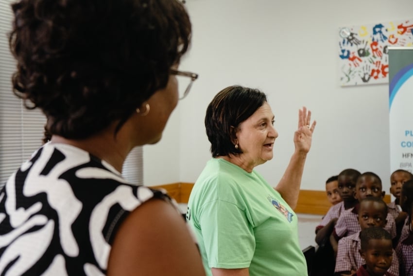 Teacher talking to children at KW Von Marees Combined School in Okahandja, Namibia