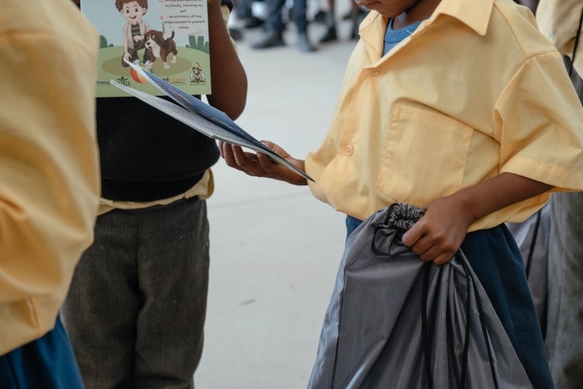 Children looking happily at their stationary received by Gondwana Collection Namibia