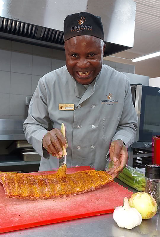 The Desert Grace, Chef applying marinade to ribs, Namibia