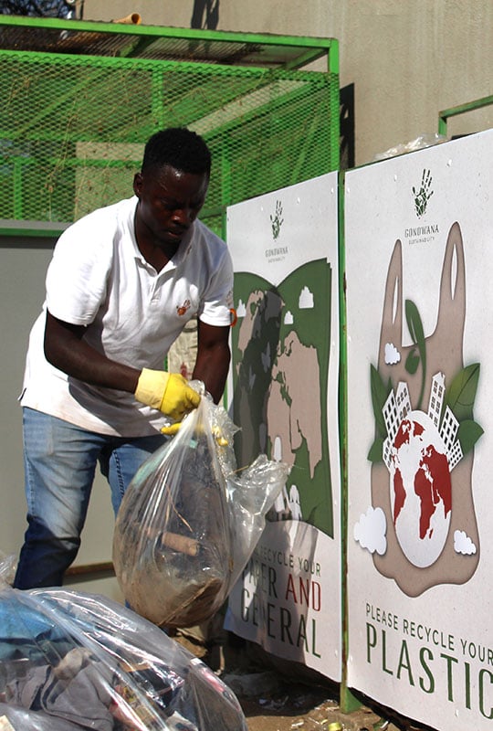 Waste management, man sorting waste, Namibia munika small