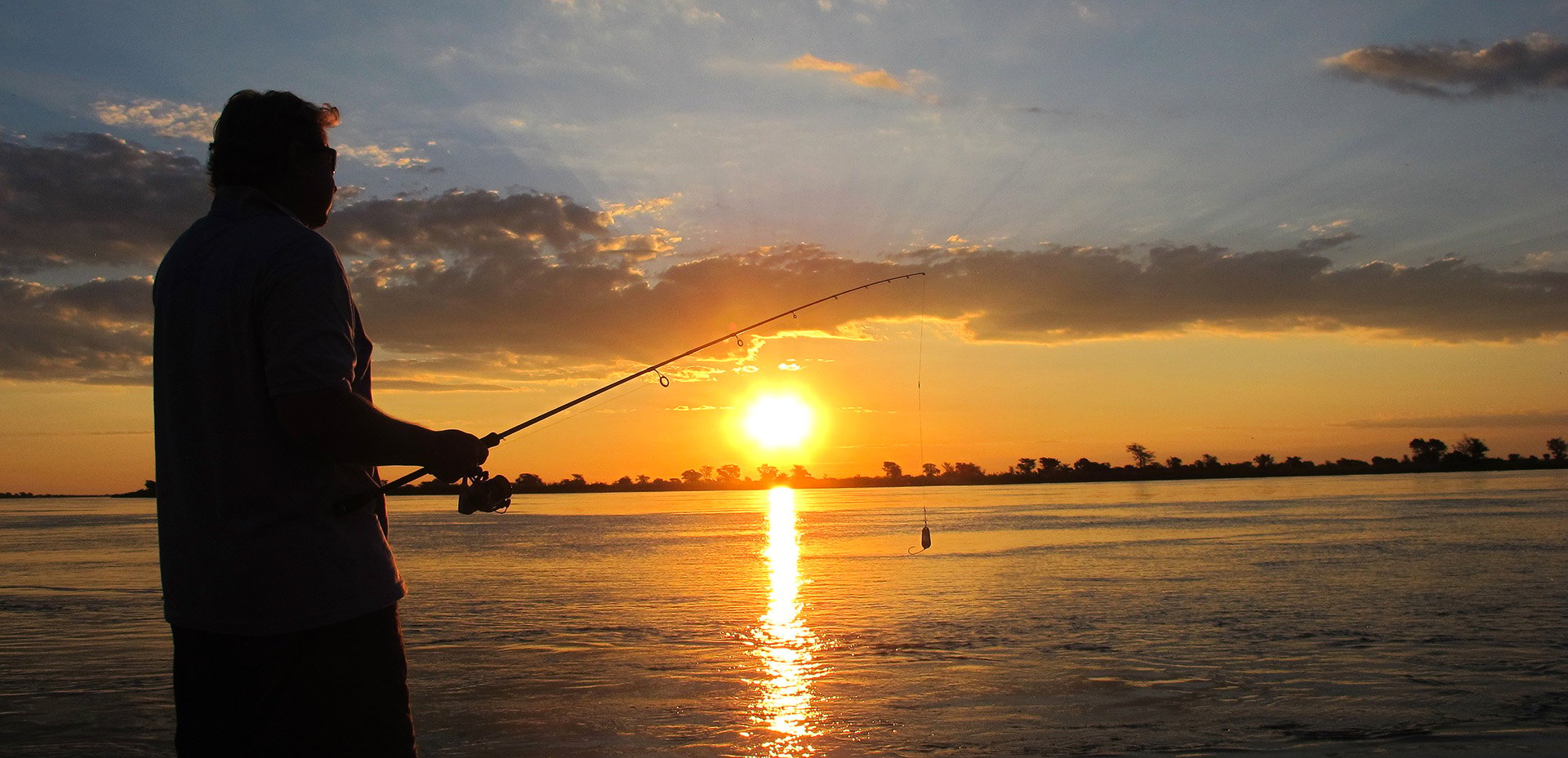 Fishing on a Namibian river at sunrise