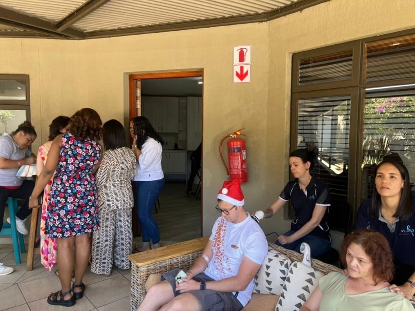 Team members at Gondwana Collection Namibia getting a neck and shoulder message