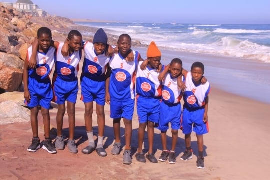 Boys on beach at Swakopmund, Namibia for volleyball game