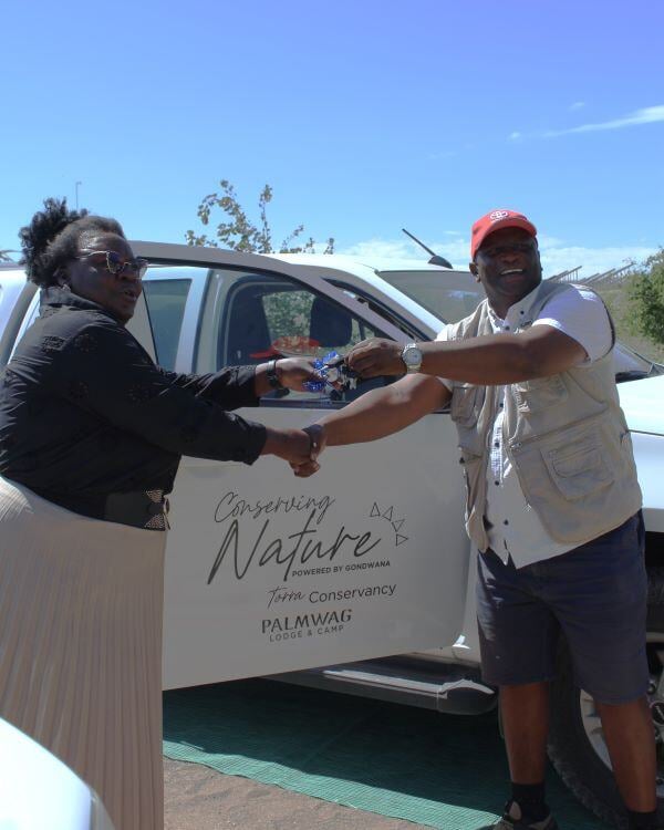 Conservancy representative receiving car during handover for the Torra Conservancy. 