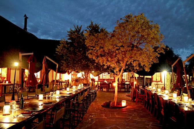 At which Gondwana Lodge can you experience such an atmosphere while having dinner? 