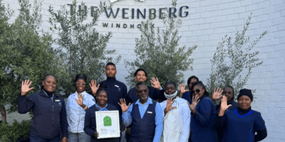 The Weinberg Windhoek team proudly holding their Tripadvisor Travellers’ Choice Award in celebration