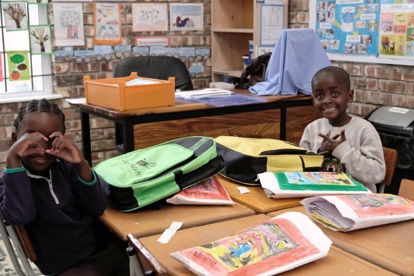 Kids at Grow Together Kindergarten with school bags and stationery received through donations via Gondwana Care Trust