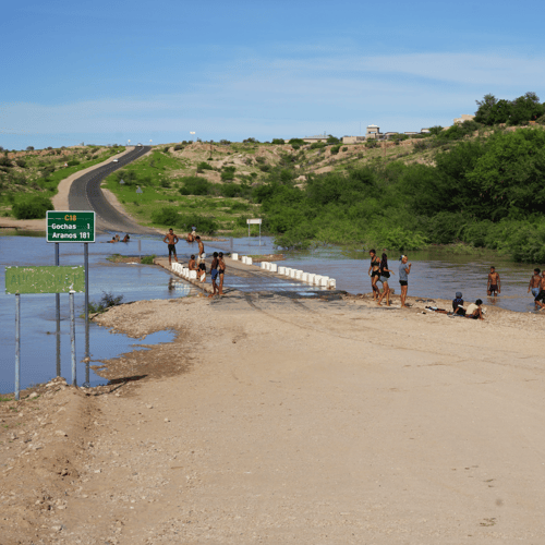 Flooded road near Gochas, people bathing