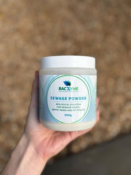 Close-up of Baczyme Sewage Powder containers, a biological product that breaks down fats, oils, and grease safely.