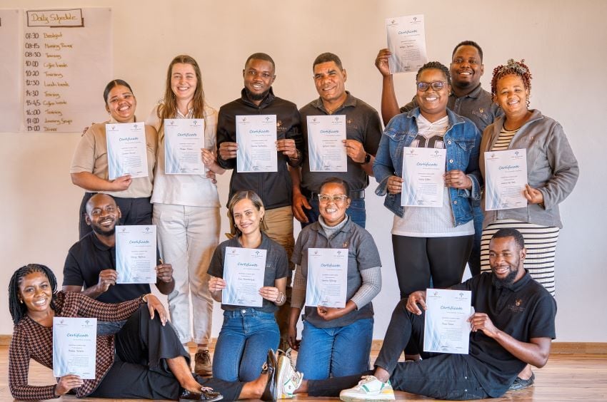 Leadership Academy graduates pose with their certificates. 