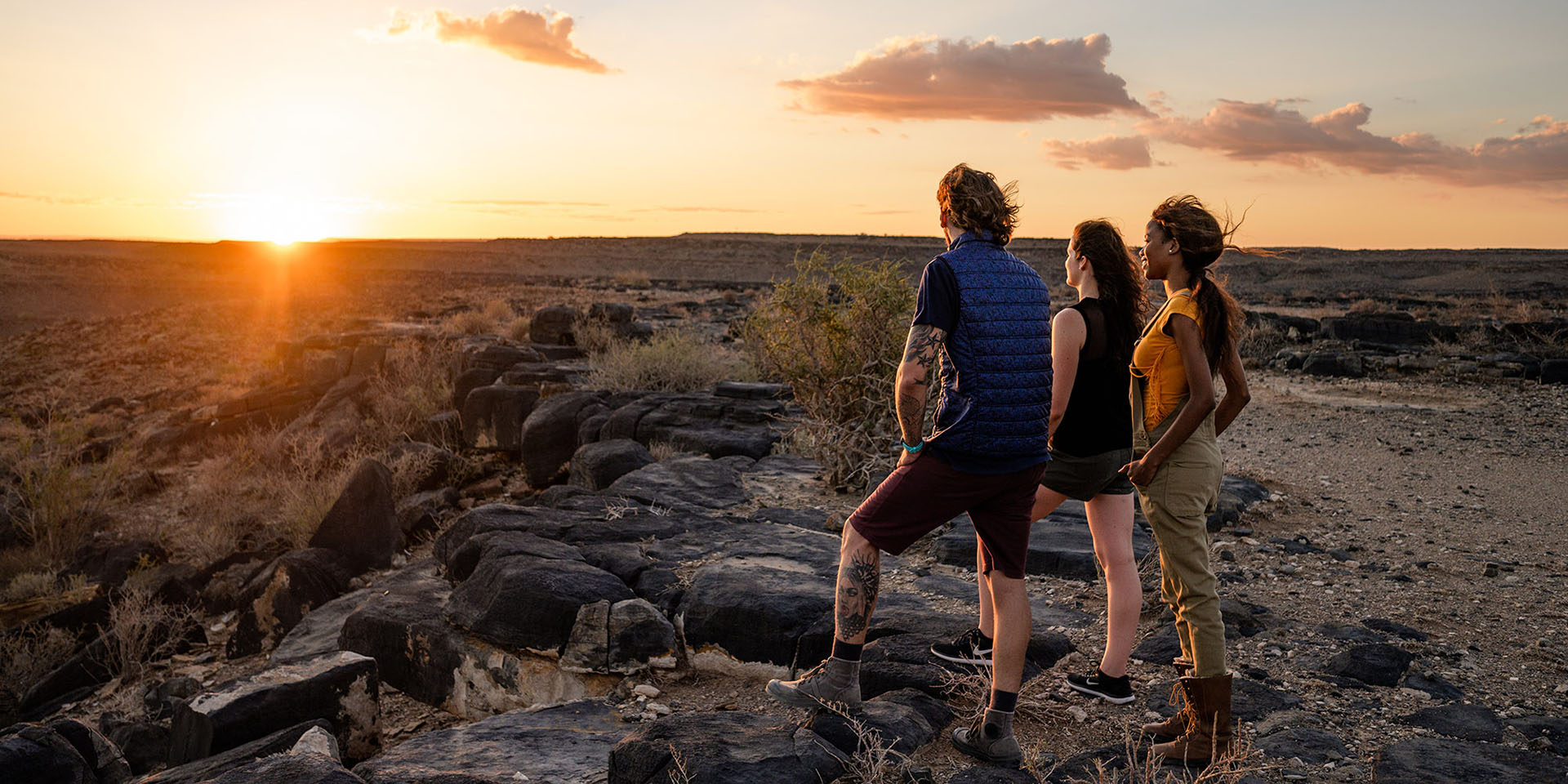 People overlooking the Fish River Canyon at sunset, Namibia