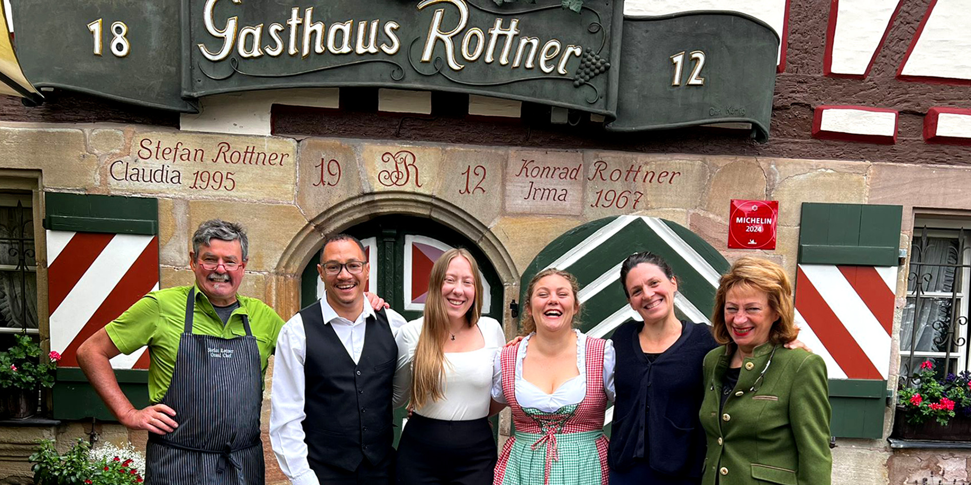 Group of people in front of a German Hotel