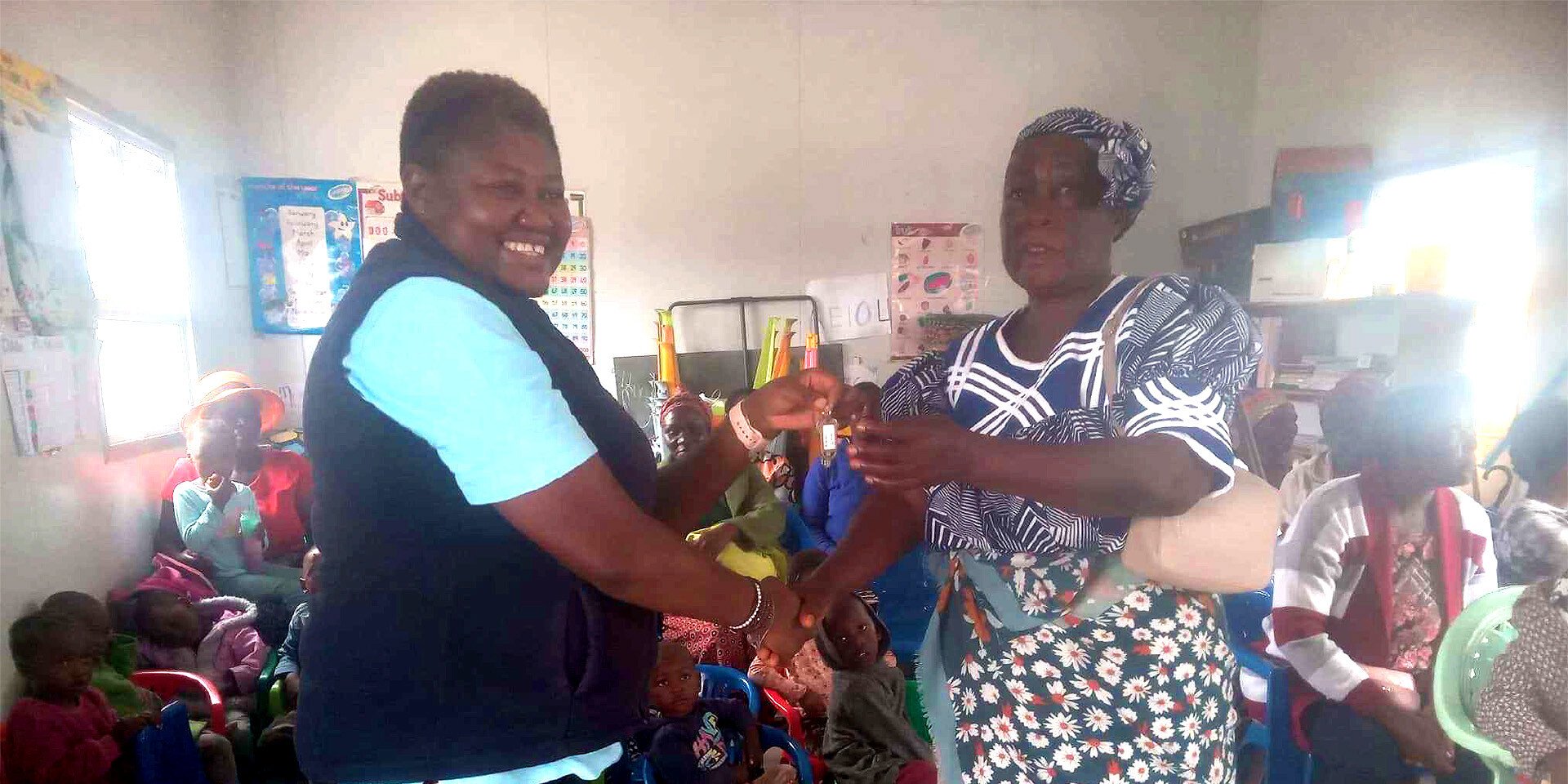 Handshake between two Namibian women