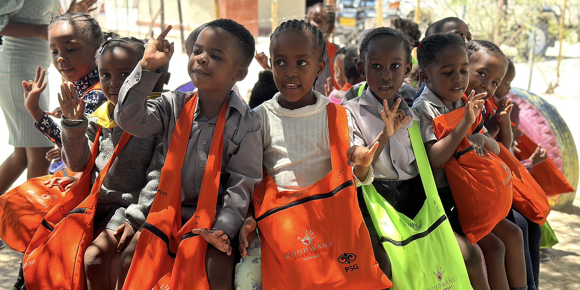 Namibian children with colourful reusable bags