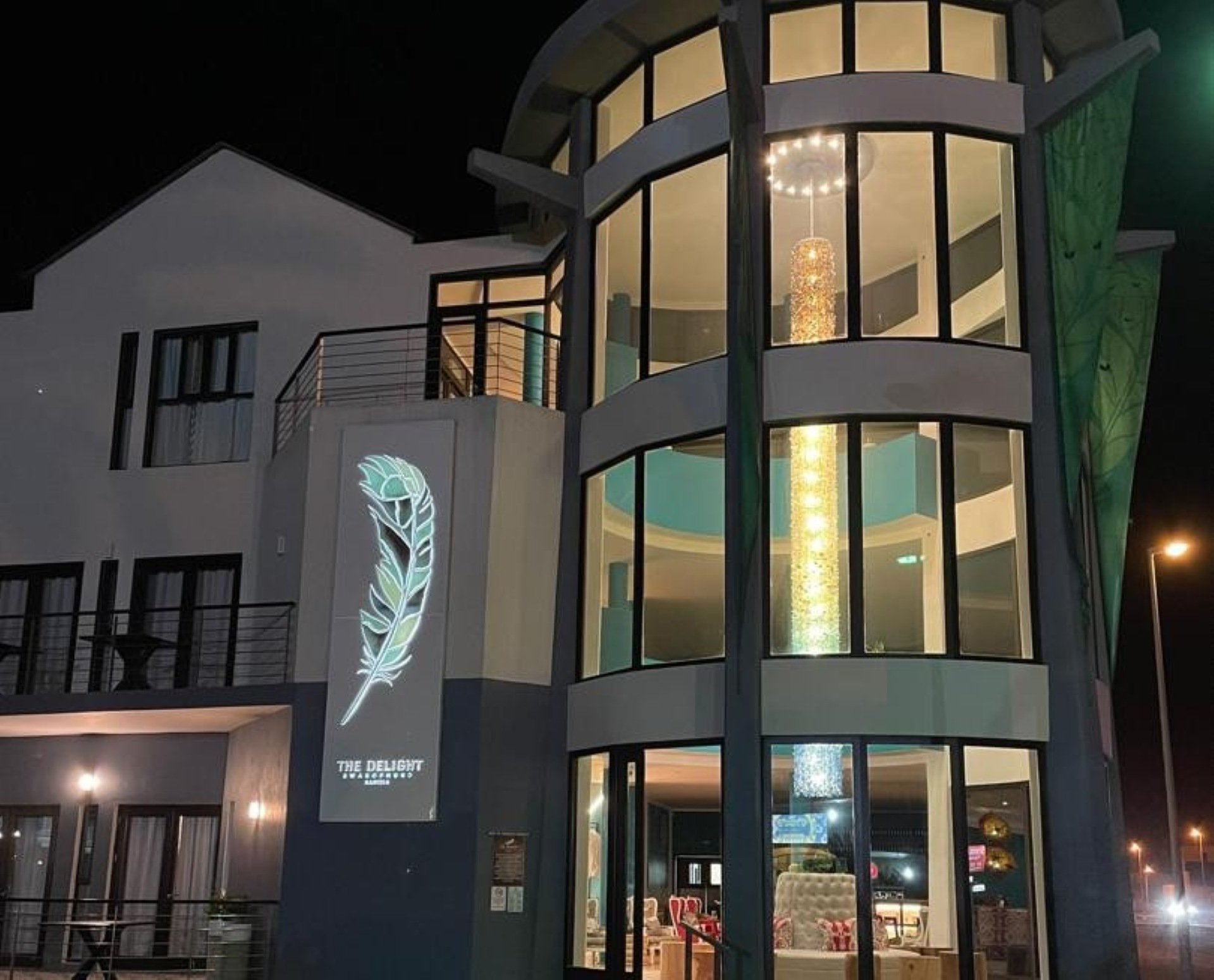 Recycled glass chandelier at The Delight Swakopmund inspired by Namibia’s journey from desert dunes to the Atlantic Ocean.