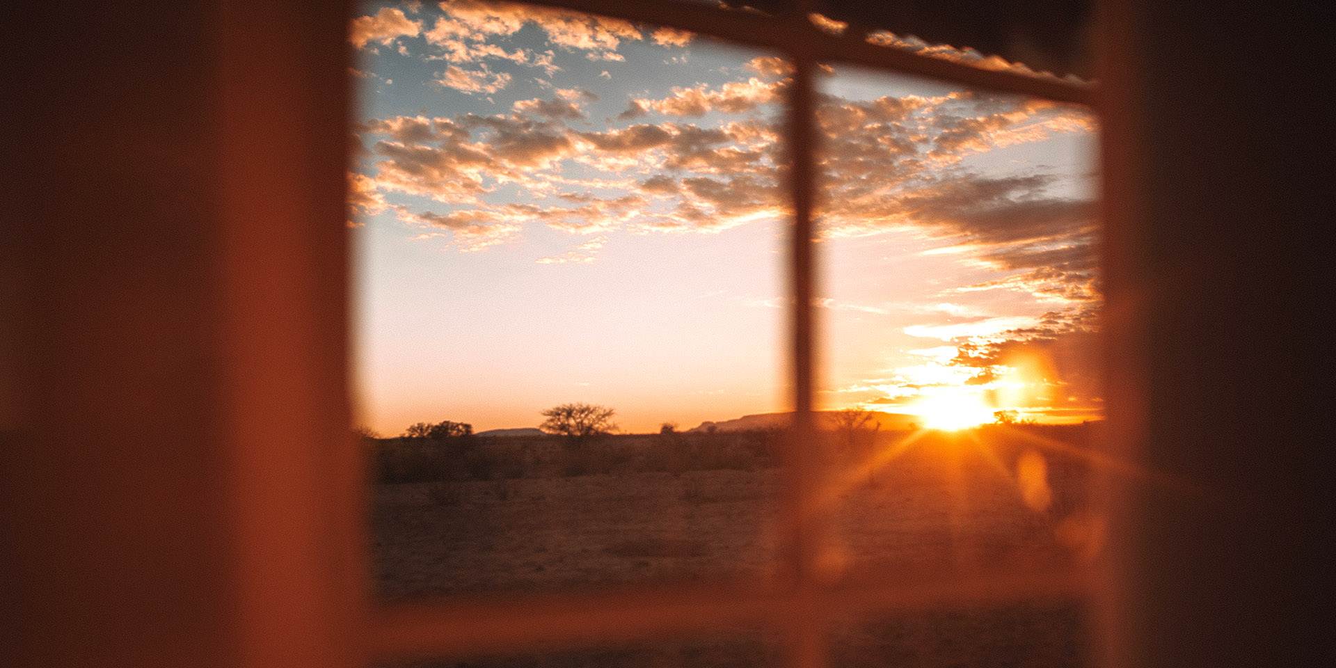 Sunset in Namibia through window