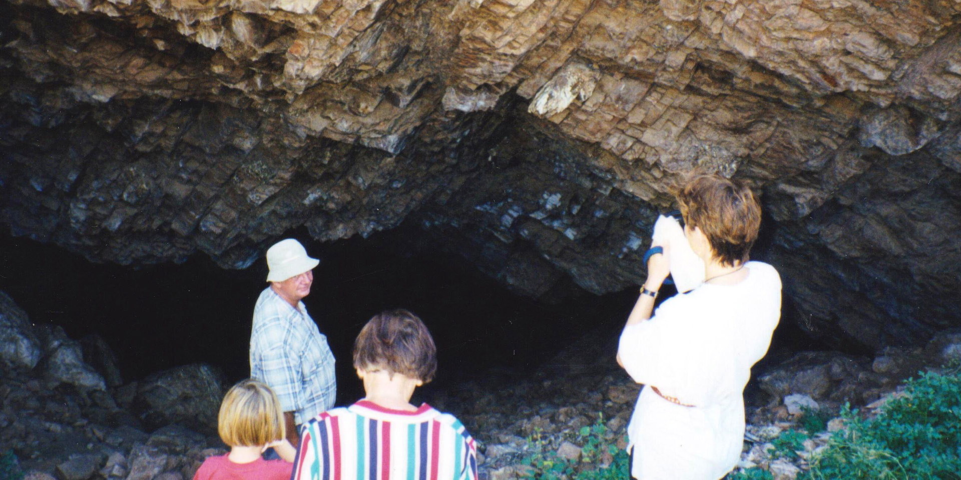 People in front of cave, Namibia