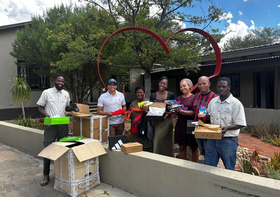 Super Eagle Football Club players in Maltahöhe wearing newly sponsored soccer kits with pride and unity.