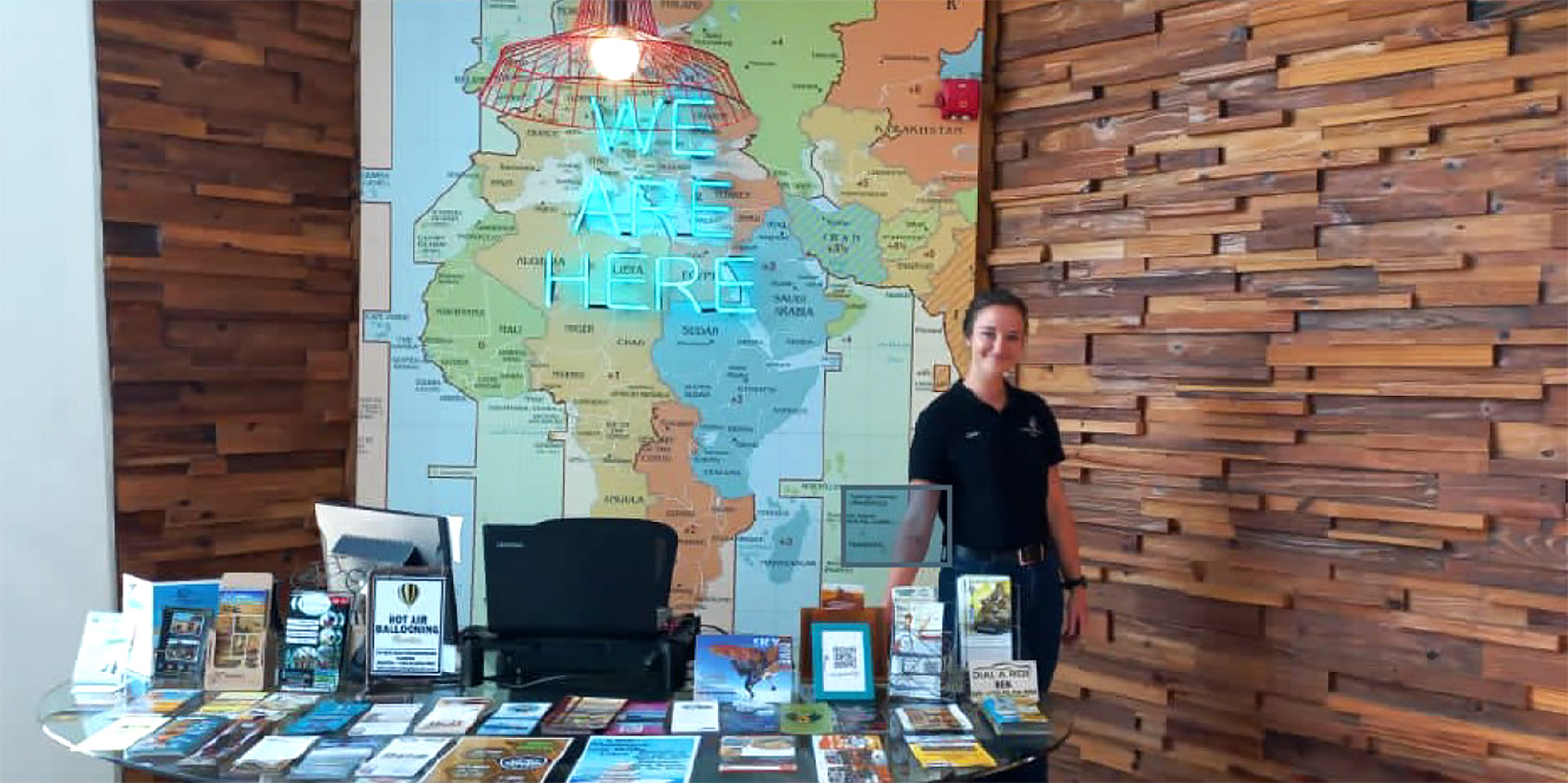 Travel  consultant in front of world map, Namibia
