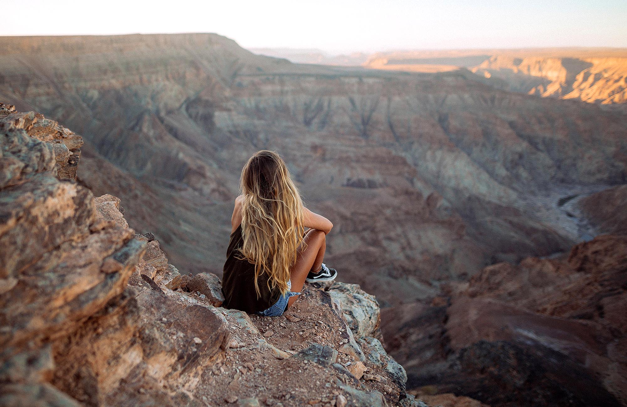 Woman enjoying the view over Fish River Canyon, Namibia