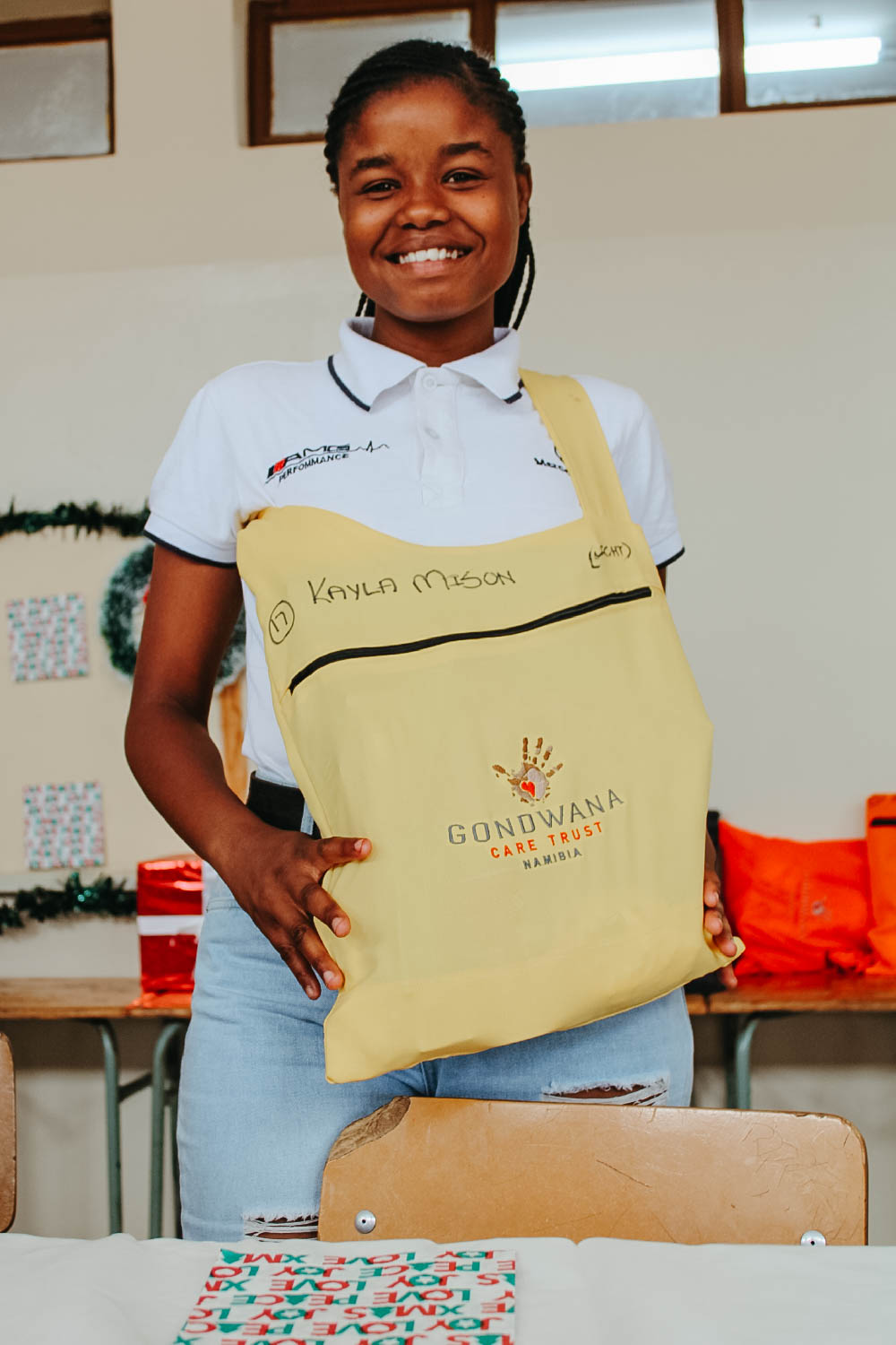 Young Namibian lady, receiving her Back-to-School Chrismas Bag
