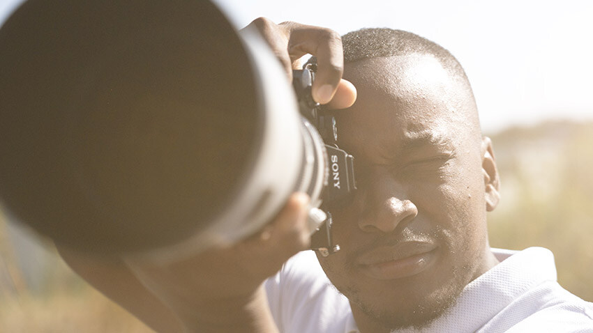 Man taking a ohoto with a GoPro Rental Photo and Video camera, Namibia