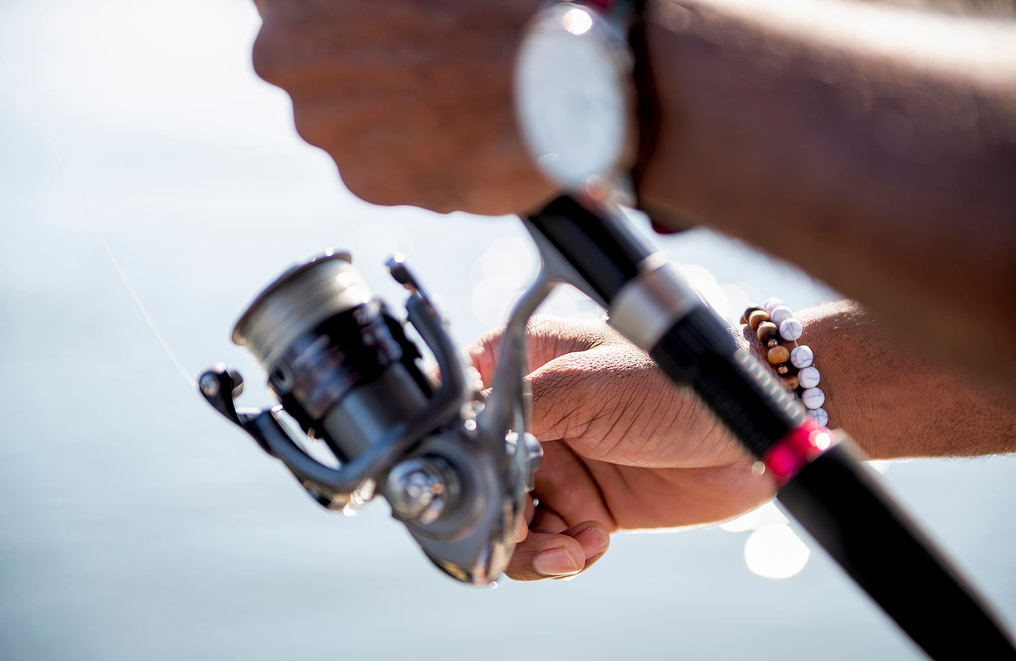 Hands holding fishing rod 