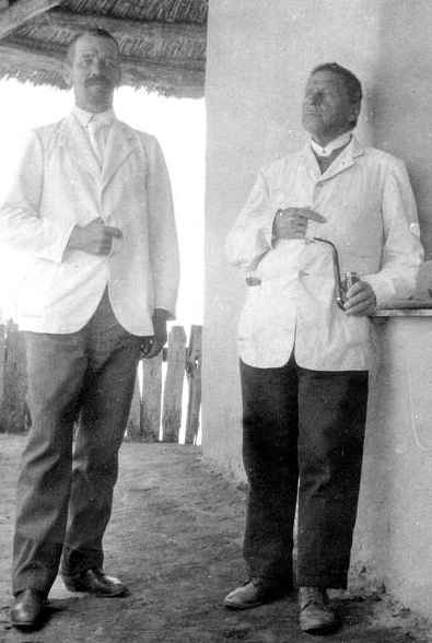 The reverends M. Rautanen (r) and B. Björklund on the verandah of the Olukonda mission house. Photo: Major Pritchard ca 1915, National Archives of Namibia