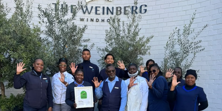 The Weinberg Windhoek team proudly holding their Tripadvisor Travellers’ Choice Award in celebration