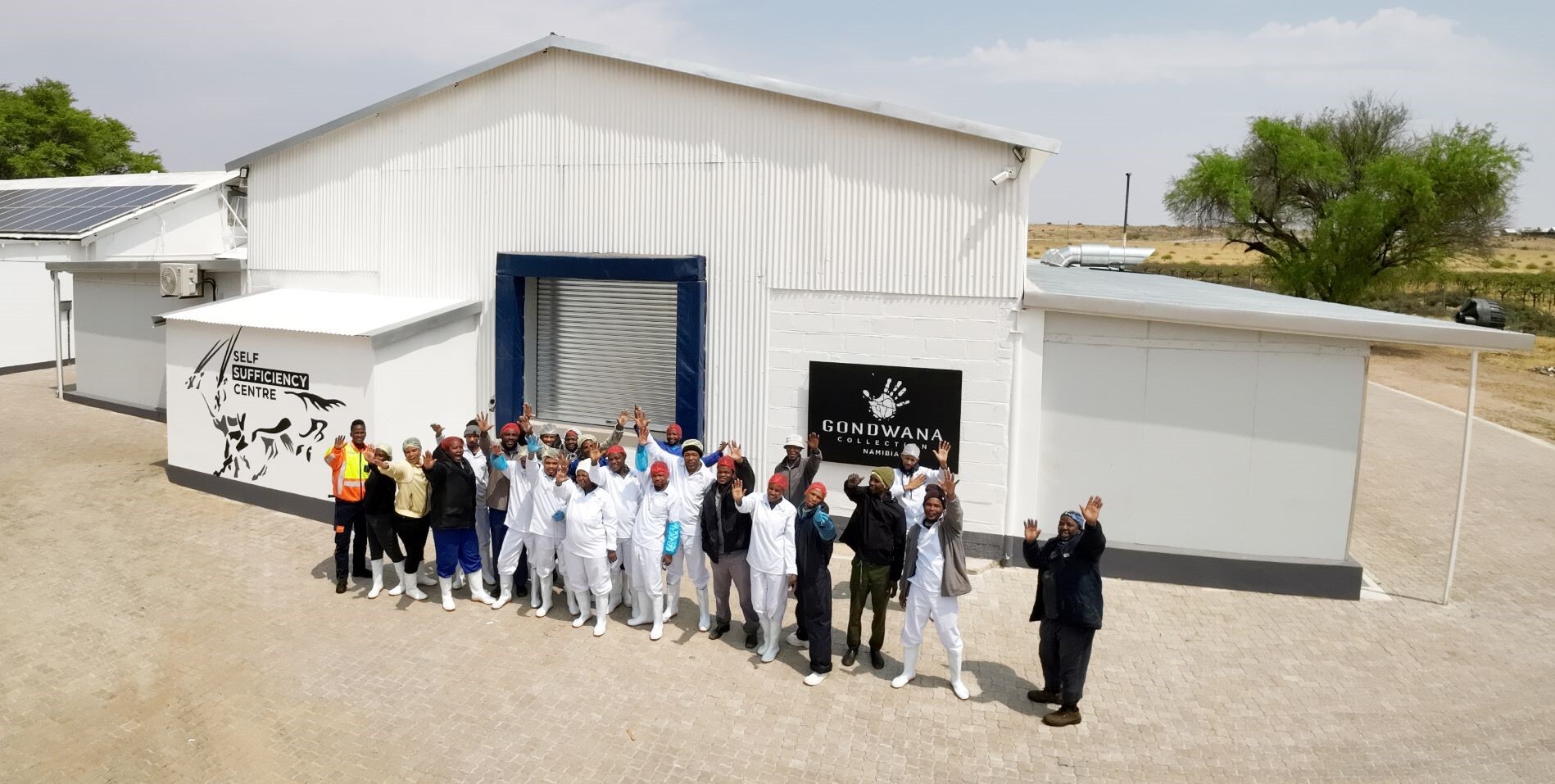 Gondwana Collection employees in front of the newly built butchery at Stampriet. 